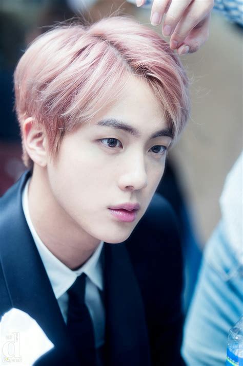 From Visuals to Vocals: A Closer Look at Kim Seok-jin's Alluring Persona